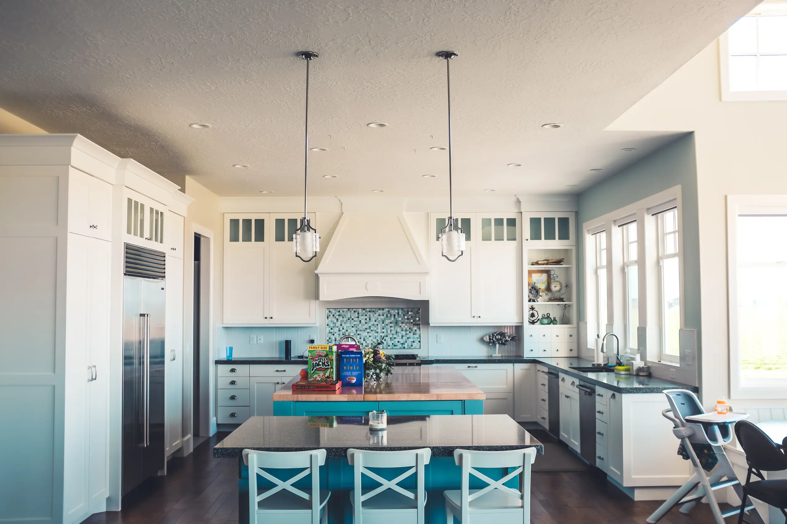 Light, tailored kitchen with a central island